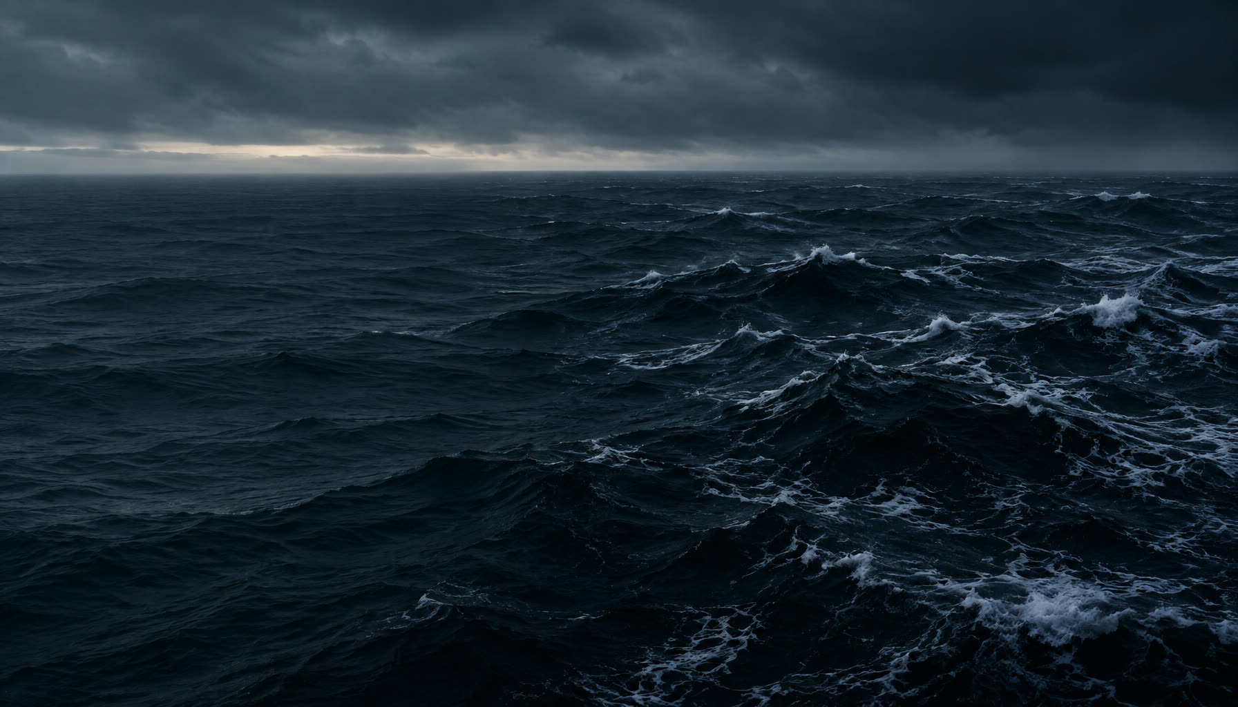 Dark, storm-lit open ocean with heavy swell.